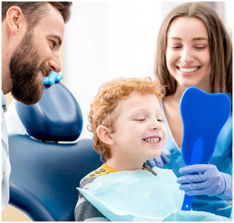stock image of boy sees his teeth with dentists