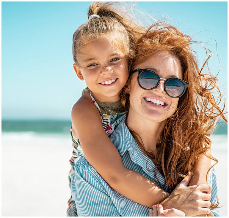 stock image of mother and daughter smiling