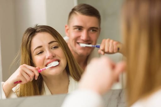 brushing teeth with a soft-bristle toothbrush