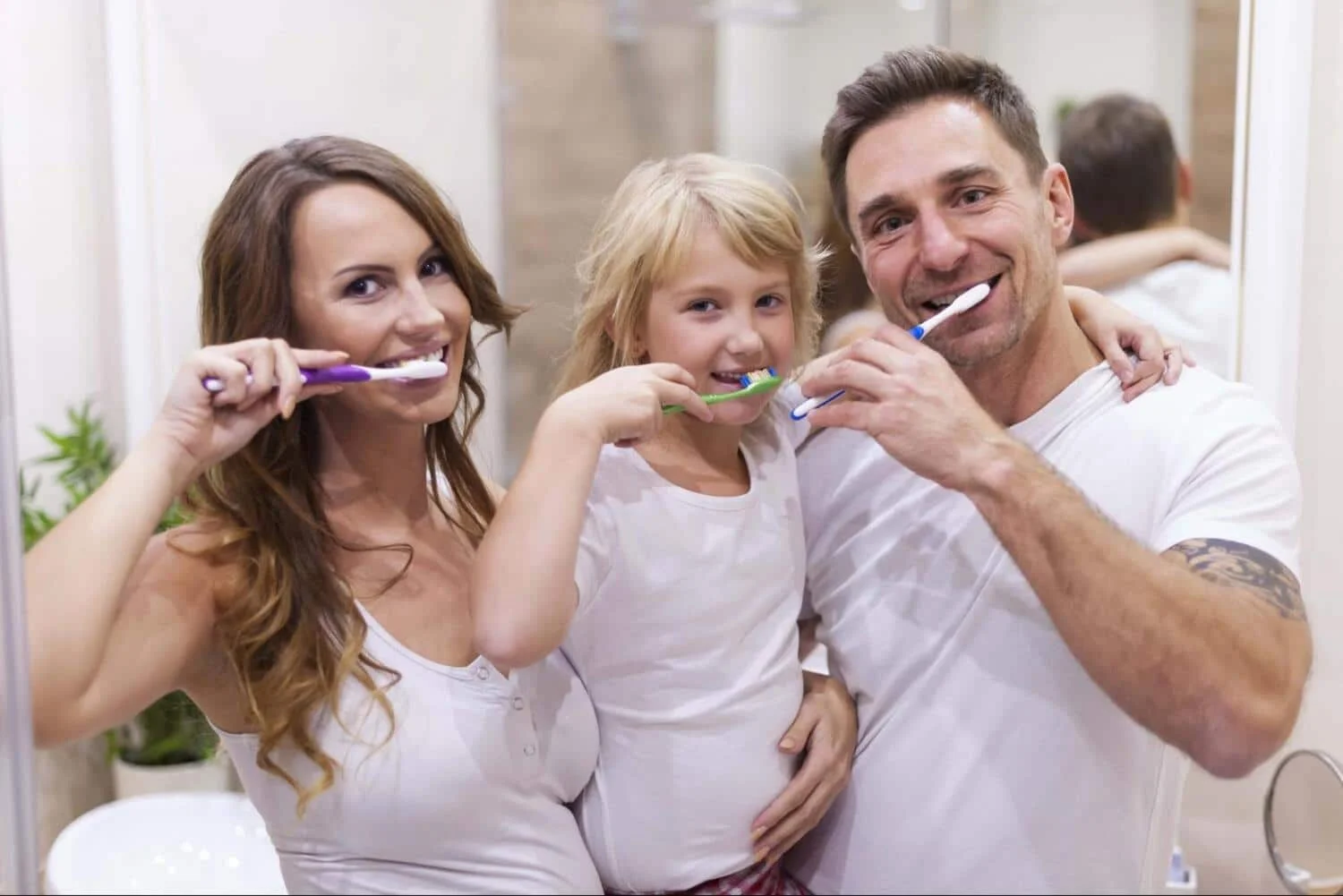 Family practicing good dental hygiene